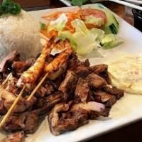 Combo Rice Platter · lamb kabob and grilled chicken served with rice, salad, pita bread, and your choice of sauce.