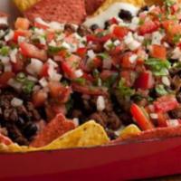 Super Nachos · Crispy corn tortillas chips topped with melted cheese, refried beans, salsa, sour cream, and...