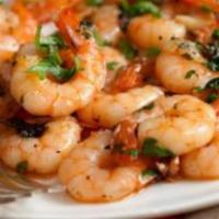 Prawns · (16) Large prawns sautéed in butter with mushrooms, and our special mild tomato sauce served...