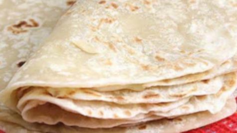 Large Flour Tortilla · Giant flour tortilla filled with cheese, guacamole, and sour cream.
