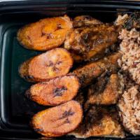 Jerk Chicken · Marinated grilled jerk chicken, with rice, beans and plantain