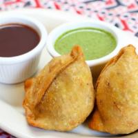 Vegetable Samosa (2 pcs) · House Special. Deep-fried turnovers stuffed with Onion, Spiced potatoes. Served with mint an...