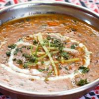 Dal Makhani · House Special. Creamed Black Lentils delicately cooked with Red Chilli's Spices.
