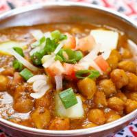Chana Masala ( Vegan) · Garbanzo beans cooked with Red Chilli's Spices.
