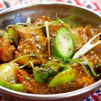 Lamb Curry · Lamb cooked with herbs and Spices in curry sauce.