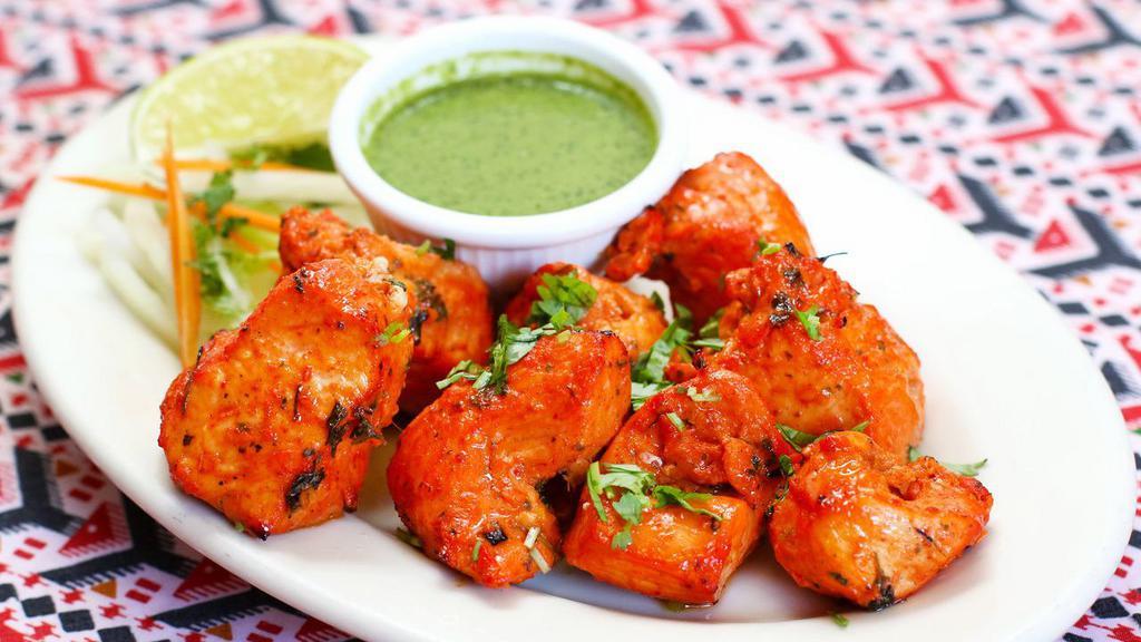 Chicken boti · Tender Juicy Cubes of Chicken Breast (Boneless). Marinated in yogurt and Red Chilli's Spices Grilled in Clay oven.