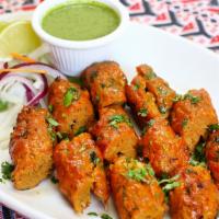 Chicken Seekh Kabab · Chicken mince rolled onto a skewer and grilled in clay oven.