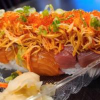 Titanic · Shrimp tempura wrapped with salmon & tuna topped with spicy imitation crab meat, avocado & g...
