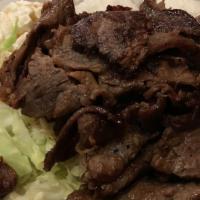 #7. BBQ Beef · Served with 2 choices of rice macaroni tossed salad or vegetables.