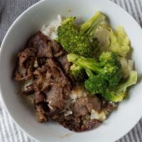 #24. BBQ Beef Bowl · Served with a side of rice and vegetables.