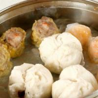 Dim Sum Combination Platter · BBQ pork bun (3), sumai (3), shrimp dumpling (3).