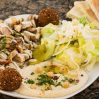 Chicken Shawerma Plate · Served with hummus, house salad, pickles, tahini sauce, pita bread and 2 falafel balls.