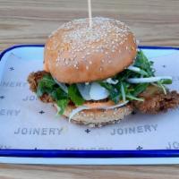 Fried Chicken Sandwich · with Calabrian chili aioli, shaved fennel and arugula on butter toasted sesame bun