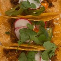 Pulled Pork Tacos · 3 Tacos on corn tortillas with pickled carrots and jalapenos, radishes, cilantro, crema and ...