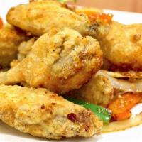 A09. Salt and Pepper wings · Battered and Deep fried mid-joint wings then stir fried with jalapeno, chili pepper, onion, ...
