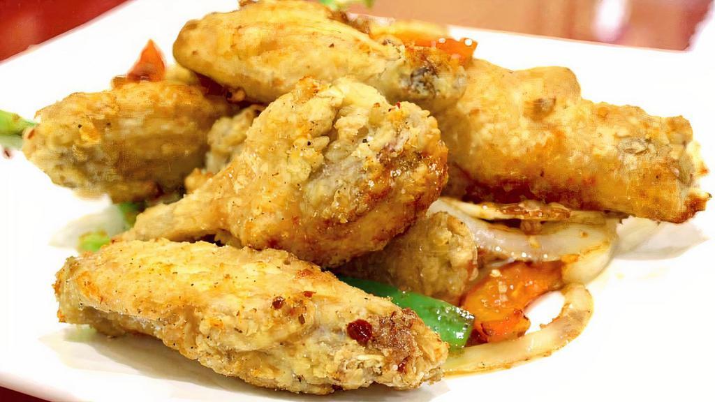 A09. Salt and Pepper wings · Battered and Deep fried mid-joint wings then stir fried with jalapeno, chili pepper, onion, garlic, bell pepper, and a touch of salt and butter.