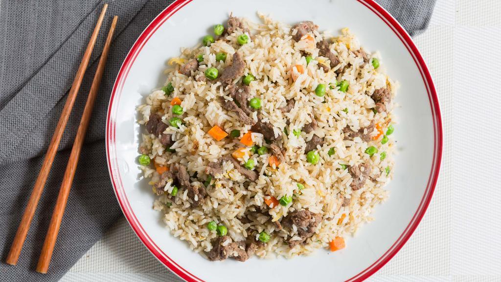 Fried Rice / Cơm Chiên · Choice of chicken, pork or beef stir fried rice with egg, green peas, corn, carrot and green onion.