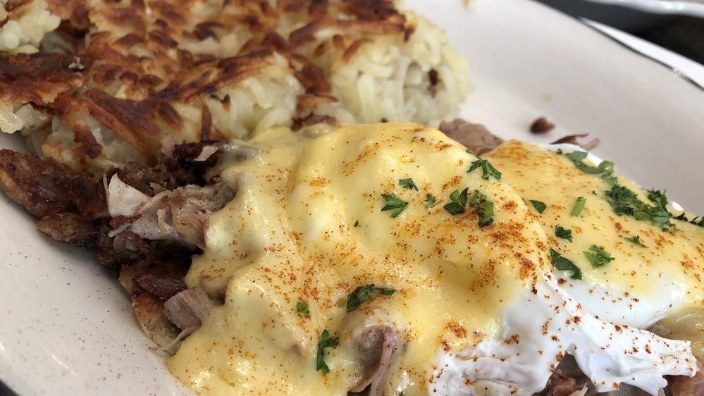 Pulled Pork Benedict · Seasoned slow cooked pork on top of english muffins with poached eggs and hollandaise sauce.