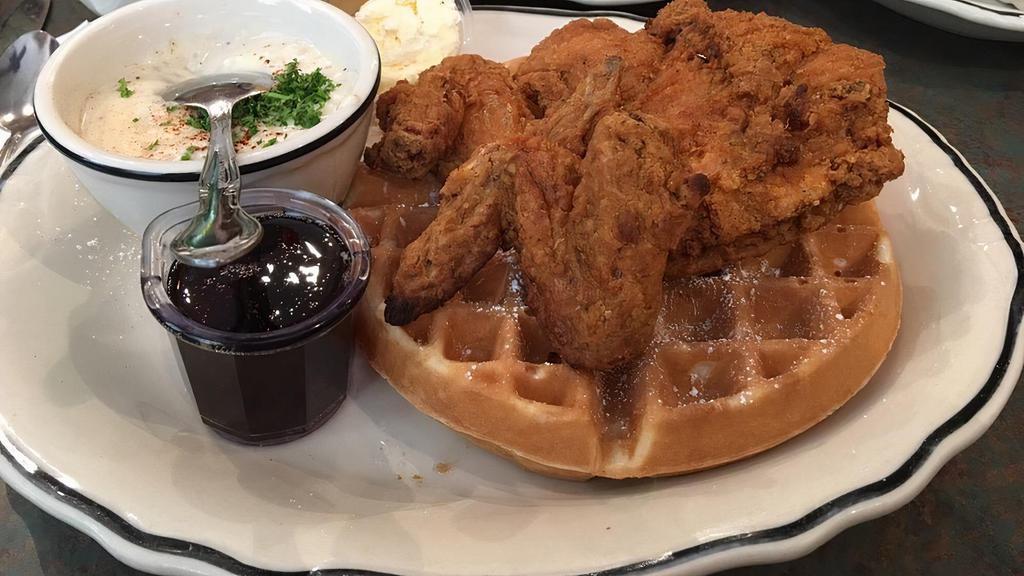 Chicken & Waffles · Sweet and savory southern fried chicken on top of a Belgian waffle.  Served with country gravy and syrup.