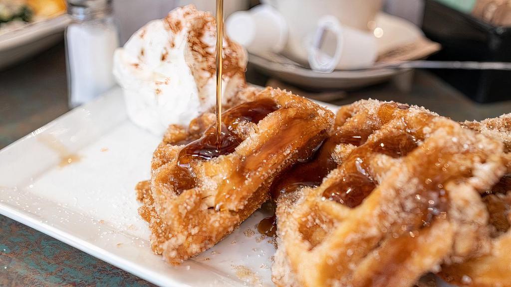 Chicken Fried Waffle · Our twist on chicken and waffles.  A waffle stuffed with our fried chicken,  then deep fried,  and covered in cinnamon and sugar.