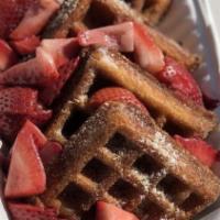 Fresh Strawberry Chuuro Waffle · Deep fried belgian waffle covered in cinnamon and sugar.  Served with whipped cream.  Topped...