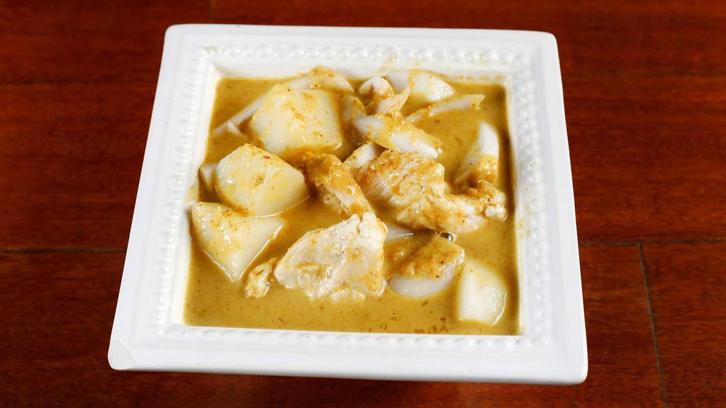 Yellow Curry (Kang-Kra-Ri) · Thai yellow curry with coconut milk, potatoes, onions and carrots.