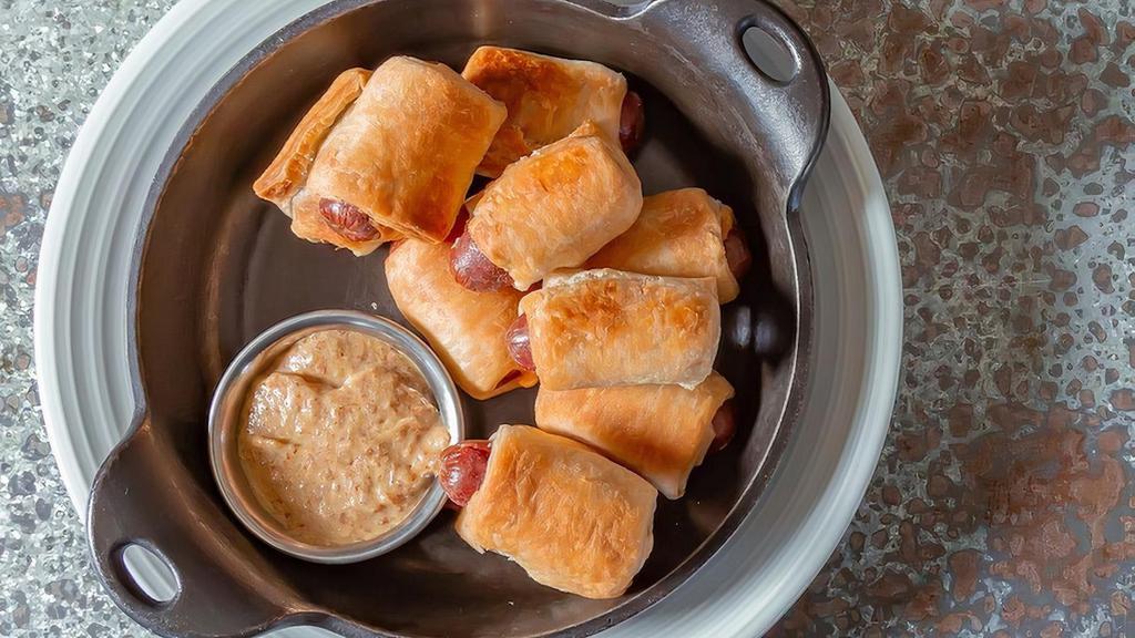 Pigs In A Blanket · all-beef franks, puff pastry, spicy brown mustard.