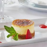 Caramelized Cheesecake · graham cracker crust, strawberry sauce,. caramelized top