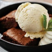 Warm Brownie & Vanilla Gelato · triple chocolate brownie, housemade vanilla gelato, whipped cream