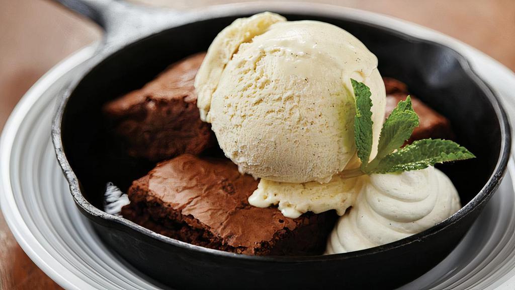 Warm Brownie & Vanilla Gelato · triple chocolate brownie, housemade vanilla gelato, whipped cream