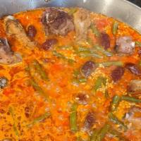 Paella Carne · Authentic All Meat Paella. Enjoy our Spanish Chorizo, pork riblets and chicken drummettes wi...