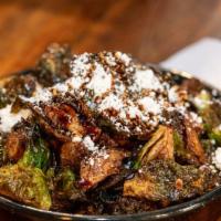 Brussel Sprouts · Flash fried brussel sprouts, goat cheese, pedro ximenez reduction. Vegetarian.