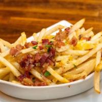 Spanish Fries · Truffle fries topped with tres leches cheese and bacon.