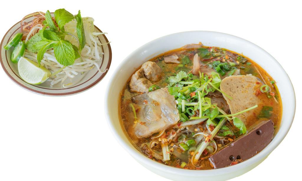 39. Spicy beef noodle soup / Bún bò Huế · Beef shank, pork leg meat, pork cake, pork blood.