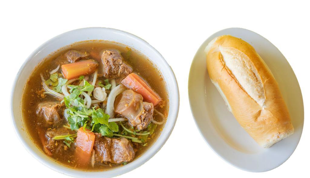 40. Beef stew with bread / Bò Kho Bánh Mì · Beef shank, tendon, carrot served with bread.