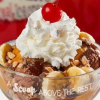 Peanut Butter Cup Sundae · Vanilla ice cream, hot fudge, warm peanut butter, reese's chunks, whipped cream and a cherry...