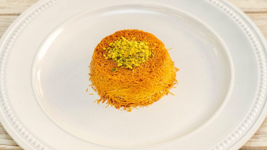 Knafeh  · Buttered shredded fillo dough filled with your choice of cream or cheese, baked to perfection drizzled with orange blossom sugar syrup