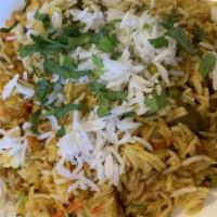 Veggie Biryani · Basmati rice with mixed vegetable, herbs and spices.