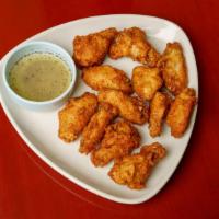 #8 Chicken Wings · Crispy deep fried chicken wings & drummets served w/salt and lemon pepper dipping sauce.