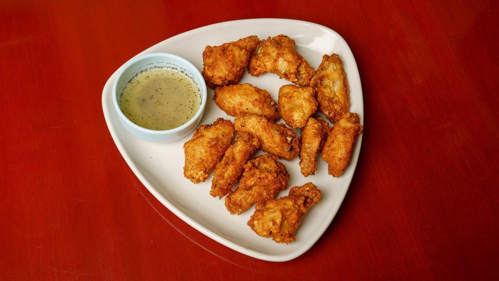 #8 Chicken Wings · Crispy deep fried chicken wings & drummets served w/salt and lemon pepper dipping sauce.