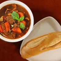 #49 Beef Stew · Beef Stew w/carrots served w/choice of French Baquette, steamed rice, or noodles (does NOT c...