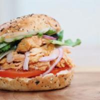 The Buffalo Bagel · Chicken in Buffalo Sauce / Provolone / Mayonnaise / Tomato / Mixed Greens / Red Onions / Bacon
