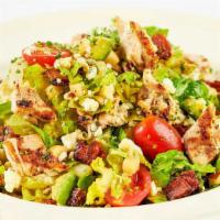Factory Chopped Salad · A Delicious Blend of Julienne Romaine, Grilled Chicken, Tomato, Avocado, Corn, Bacon, Blue C...