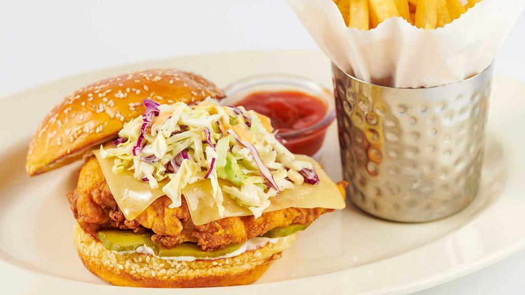 Fried Chicken Sandwich · Chicken Breast Fried Crisp with Cheese, Cole Slaw, Pickles and Mayonnaise. Served on a Grilled Bun.