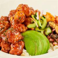 Korean Fried Chicken · Crispy Chicken Tossed with Our Spicy Korean B.B.Q. Sauce Served Over Steamed Rice with Avoca...