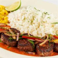 Carne Asada Steak · Steak Medallions Covered with Sauteed Peppers, Onions and Cilantro.  Served with Creamy Ranc...