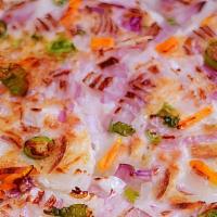 Onion Uthappam · Thick pancake topped with onions.
