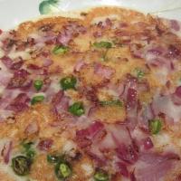 Chilli Onion Uthappam(Thick · Hot. Thick pancake topped with g. chilli and onions.