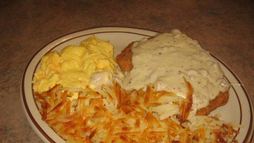 Chicken Fried Steak Breakfast · Breaded beef patty smothered with gravy, 2 eggs, biscuit and hash browns or country potatoes