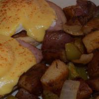 Eggs Benedict · Ham with 2 poached eggs on a toasted english muffin with hollandaise sauce and hash browns